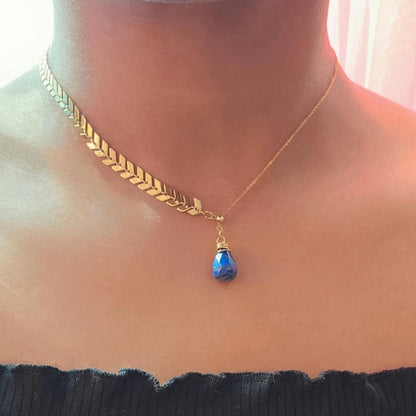Gold wire wrapped lapis lazuli teardrop crystal on half cable, half leaf chain necklace