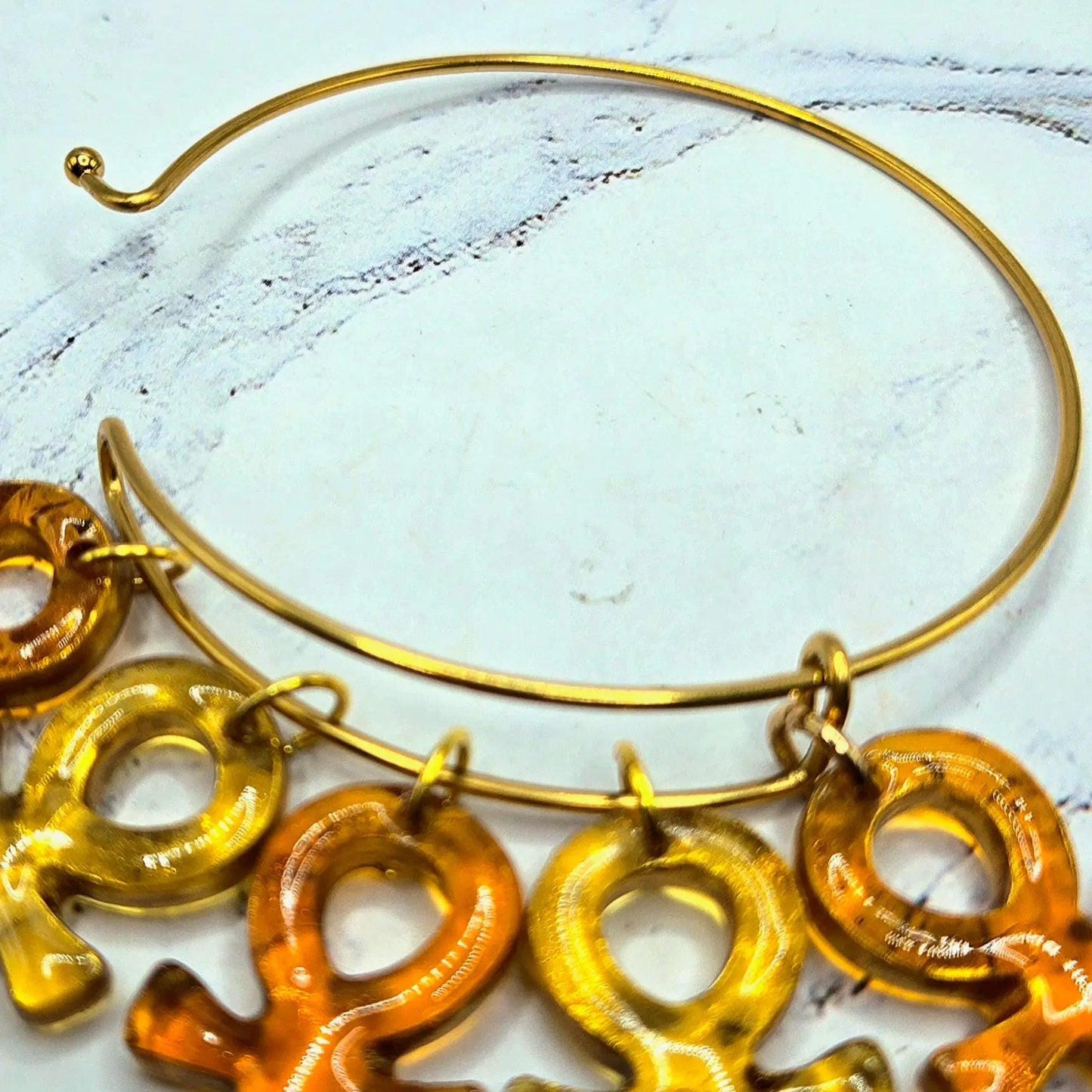 Ankh Life  bold gold amber honey large charm spiritual intention wire latch bracelet close up